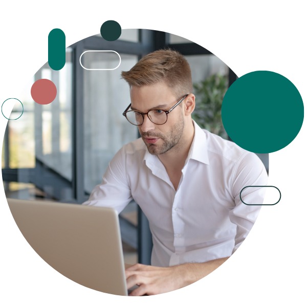 genevaos Data scientist working at a laptop with auxiliary monitor